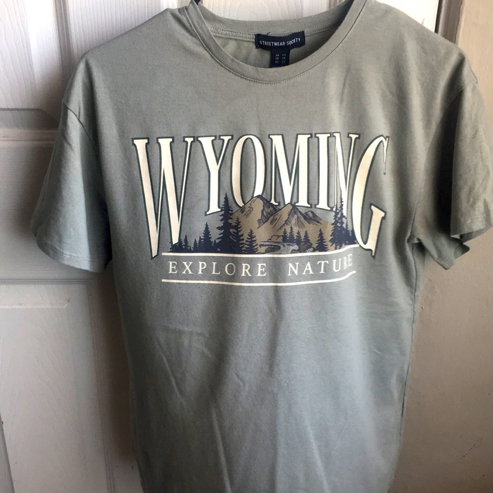 Sea green shirt with Wyoming in big white bold letters